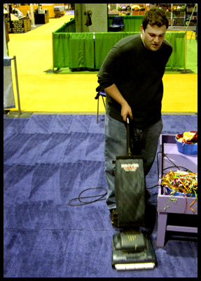 Lancaster Clark Convention Cleaning (LCCC) employee, Ryan Vanmaele is one of several crew members who vaccume booths, and get the convention center cleaned and ready for opening day.